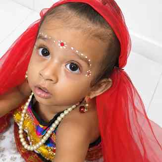 Two little boys, one dressed as Radha and the other as Krish