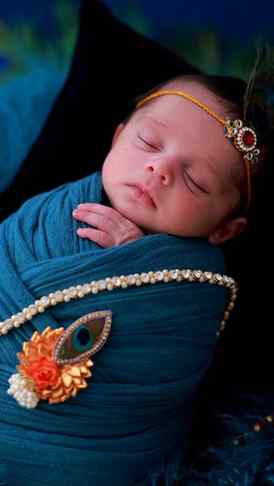 Caption 2 Our little Krishna has arrived! 💙
Tiny hands, swe