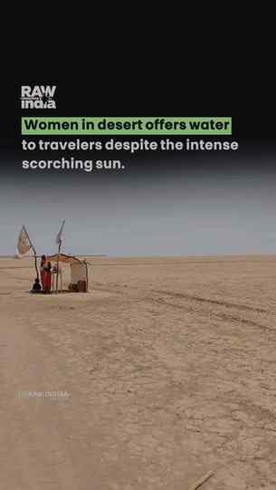 Under the blazing sun of the desert, a woman stands with her
