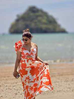 Collecting moments and tan lines  Sun,sand and a floral hand