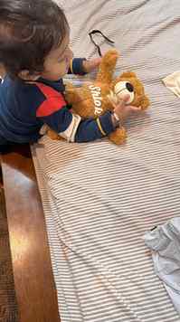 Watching him discover a teddy made just for him, with his na