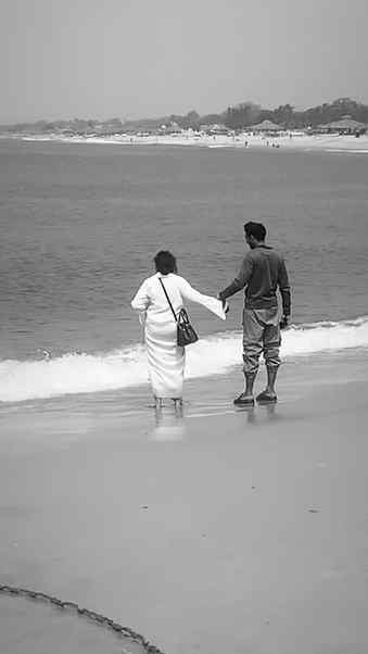The ocean roared, the world fell apart,
Yet they stood there