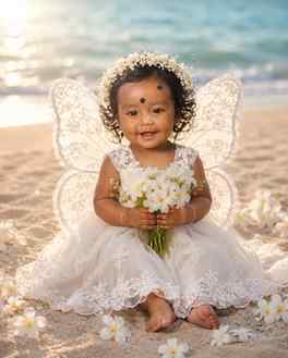 Try this prompt 👇

Create a dreamy beach fairy baby portrai